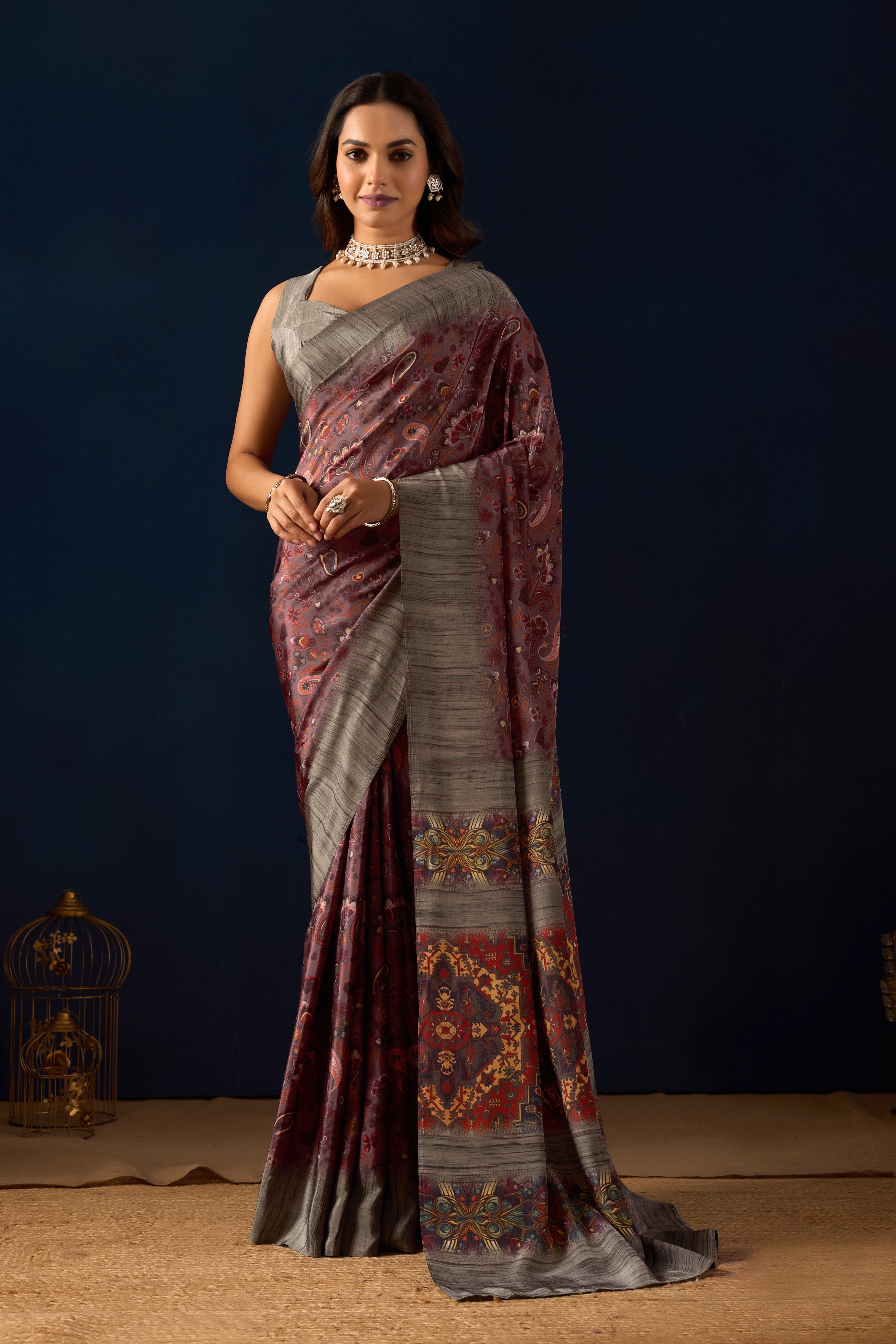 Gemini said Sophisticated Mauve Poly Crepe Saree with Regal Paisley Prints and Ornate Heritage Borders .