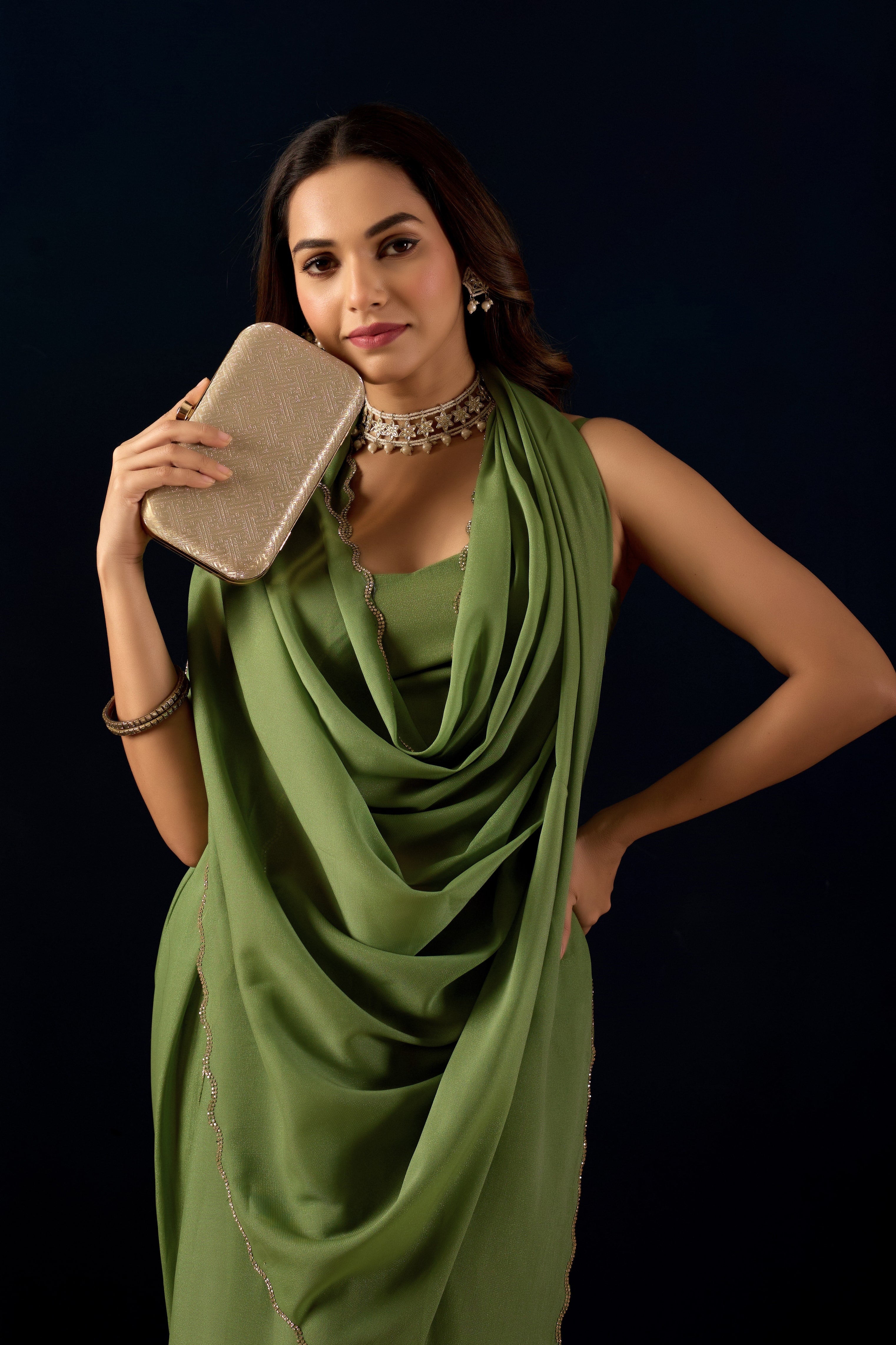 A stunning Ready-to-Wear Poly Georgette saree with a shimmering metallic finish and an elegant scalloped border for a sophisticated, hassle-free look.